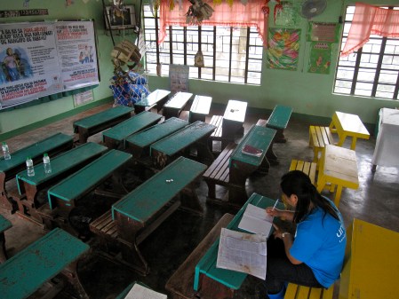 Mrs. Loreniano awaits children's return after most are unaccounted for folllowing Typhoon Bopha.